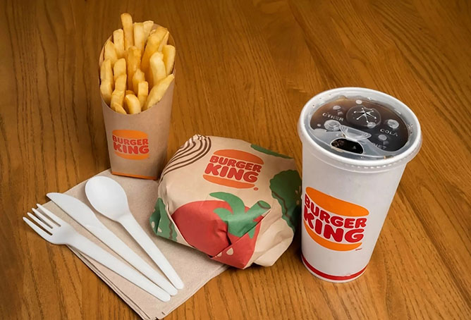 A Burger King meal served in recyclable packaging including strawless lid